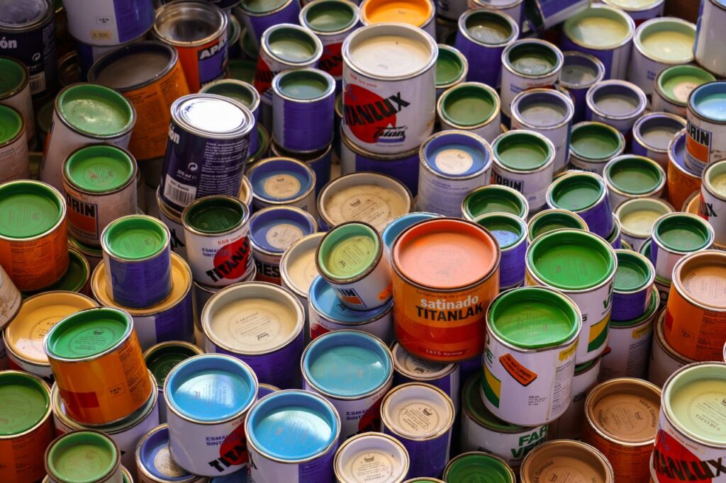 Vibrant collection of paint cans showcasing various colors in Barcelona, Spain.